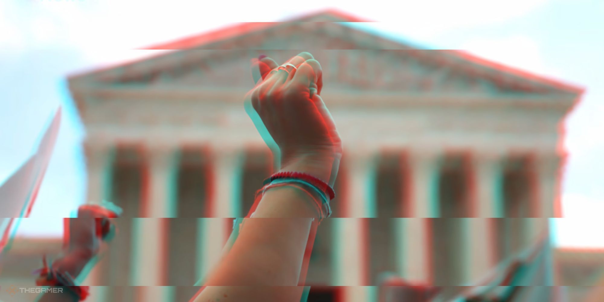 Arms raised in protest against the Supreme Court decision to overturn Roe v. Wade