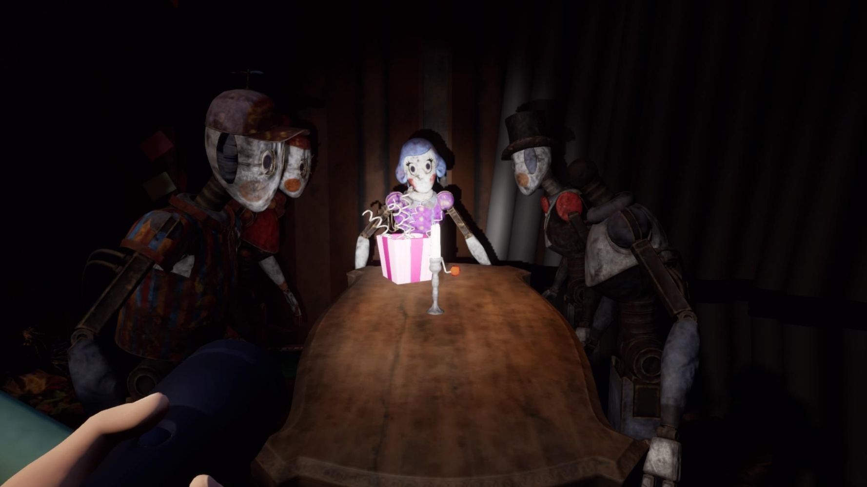 Five dressed up staff bots sit around a dining table, though one is missing its head.