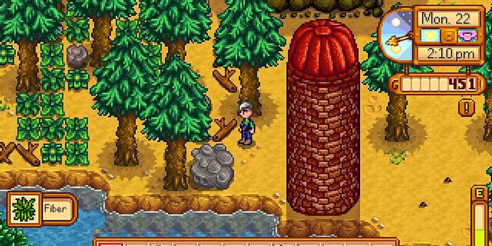 player standing next to silo on farm