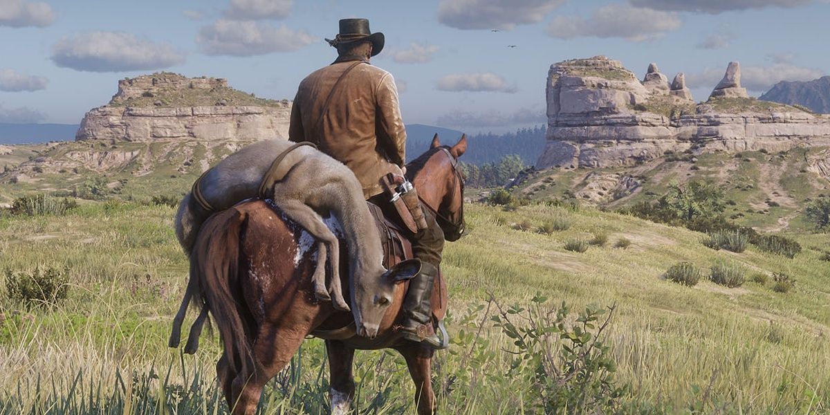 Player resting on a horse looking out at the horizon in RDR2
