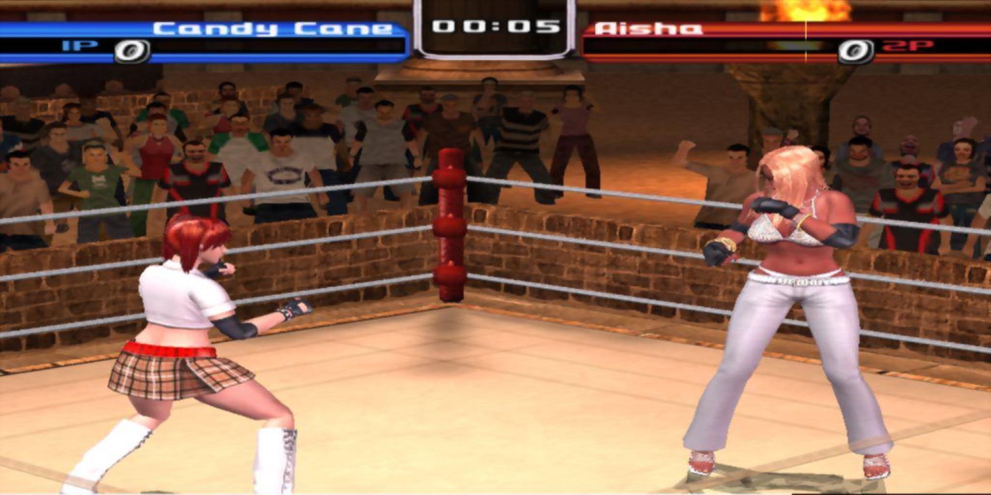 A plaid-skirted wrestler, Candy Cane, faces a J-Lo styled Aisha in a tense wrestling match in Rumble Roses.
