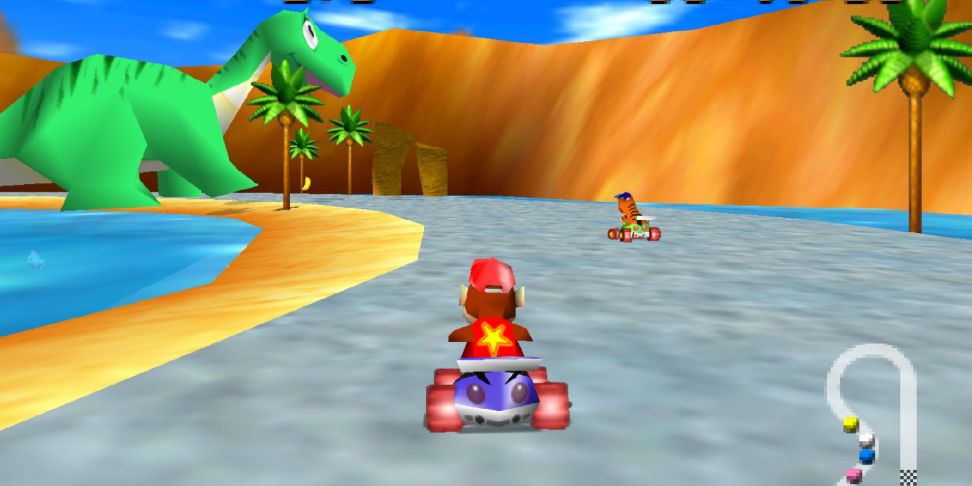 Diddy Kong races down the track on one of the dinosaur stages in Diddy Kong Racing