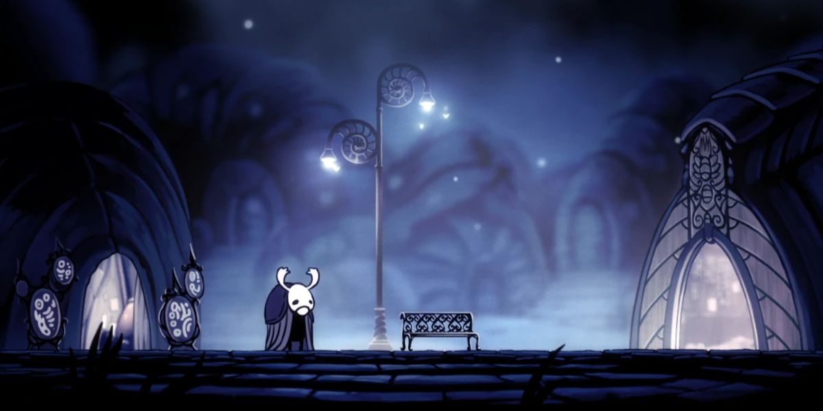 Elderbug standing next to a bench in Dirtmouth in Hollow Knight