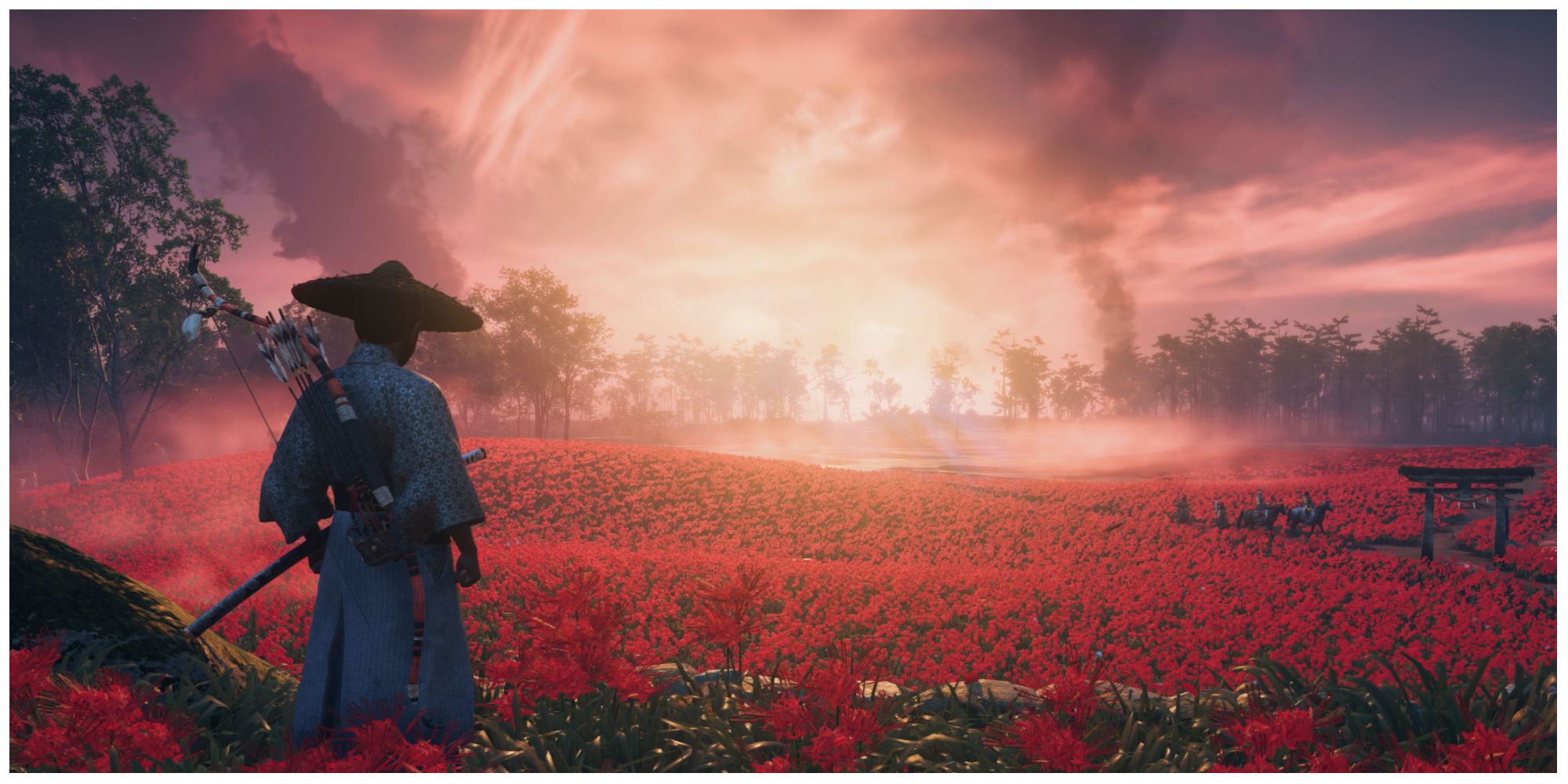 Wide shot of Jin Sakai standing in a beautiful field of red flowers