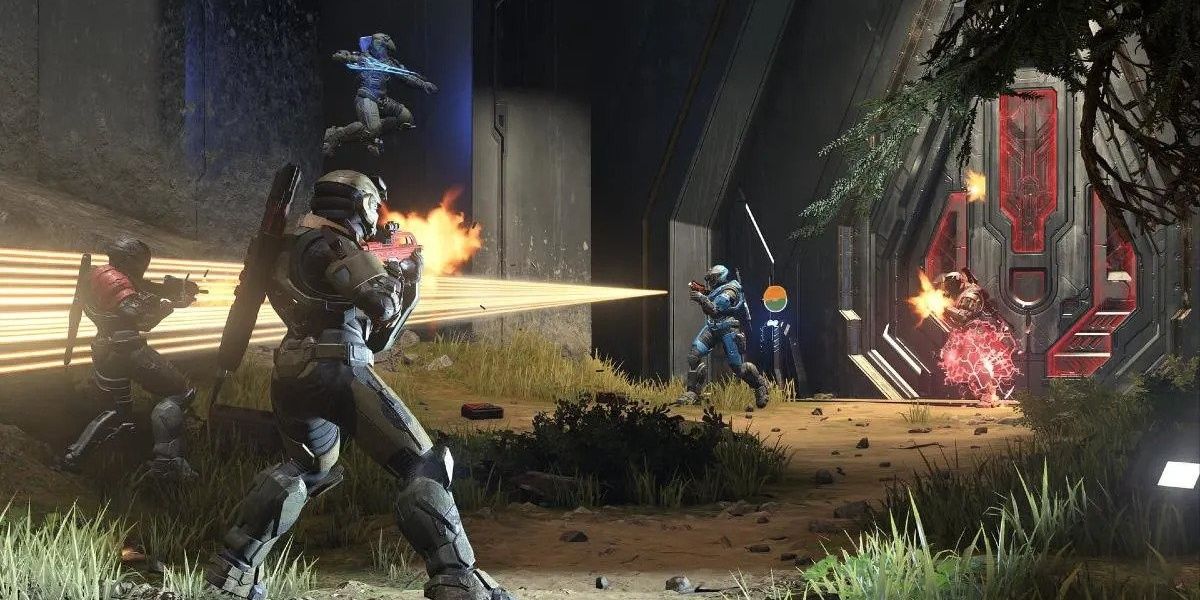 Five spartans shooting each other in a multiplayer match in Halo Infinite.