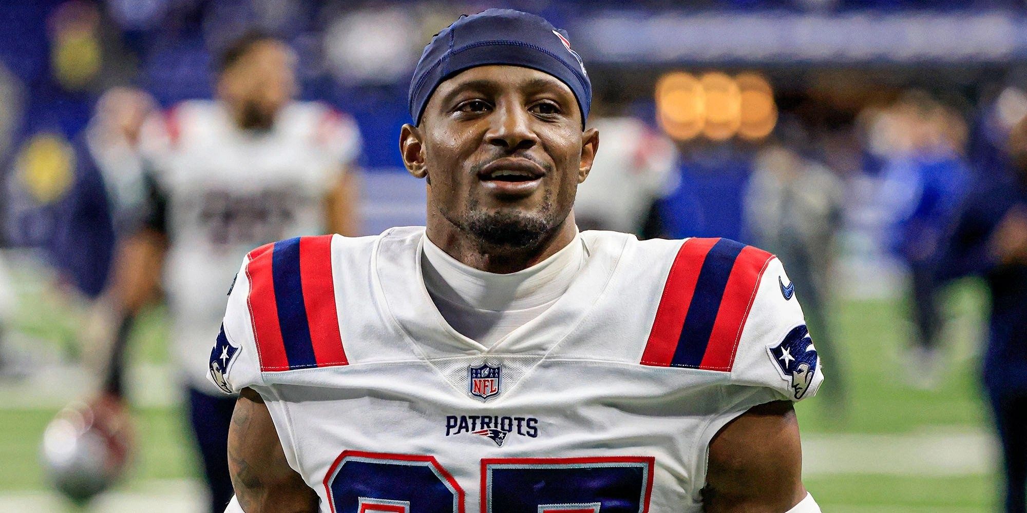 JC Jackson smiling in a white Patriots jersey