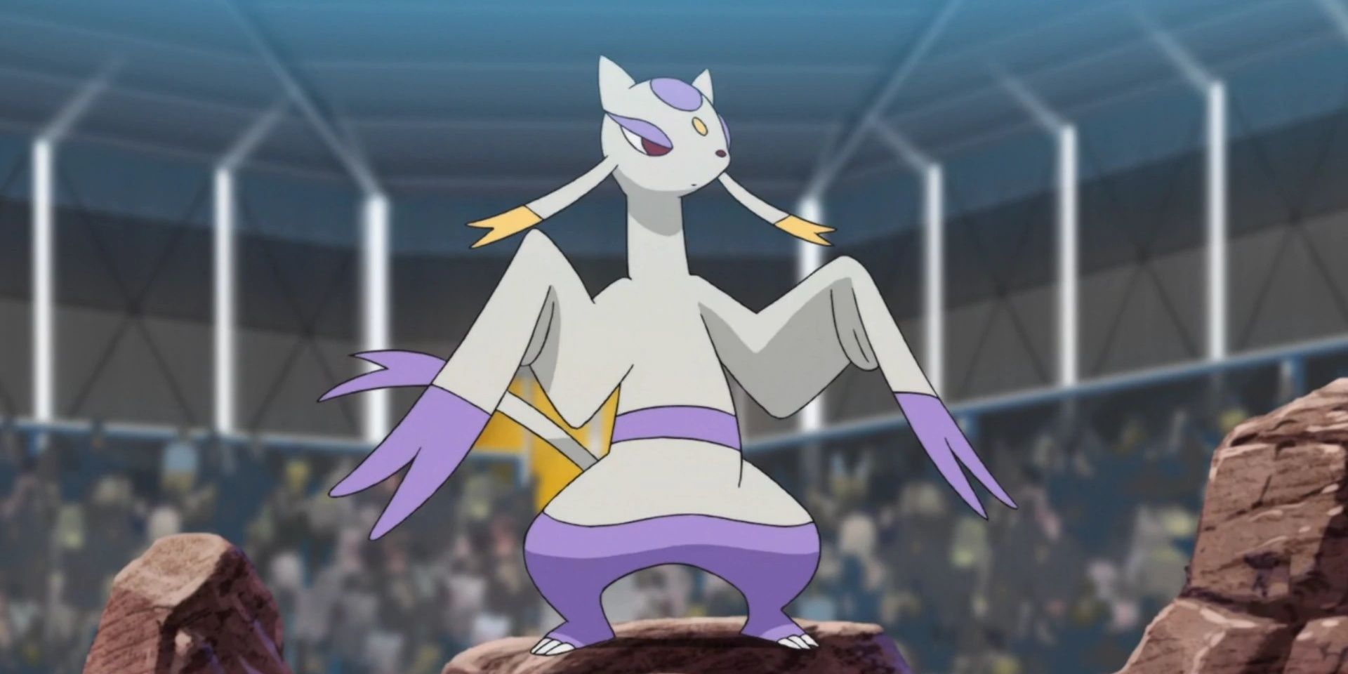 Mienshao, a Pokemon, standing on a rock in an arena.