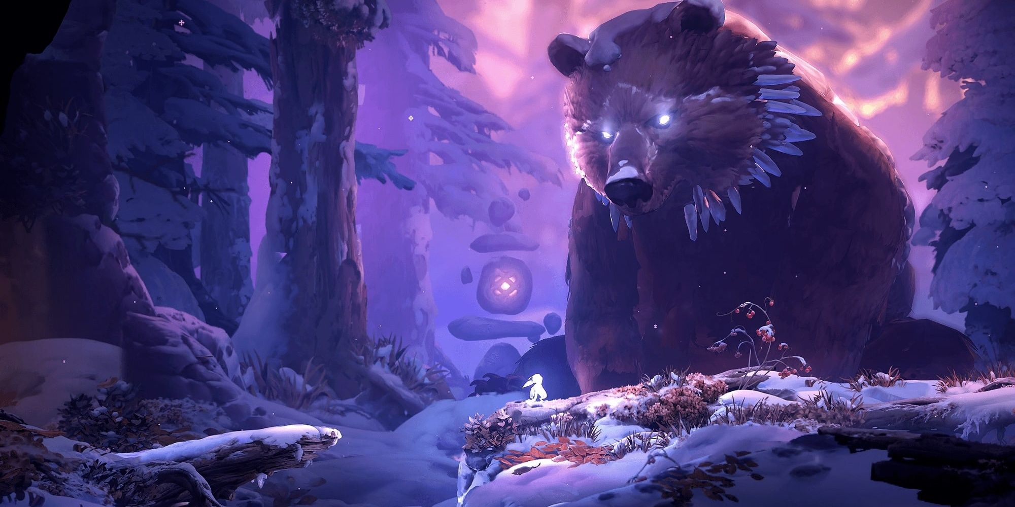 Ori standing before a massive bear in Ori and the Will of The Wisps.