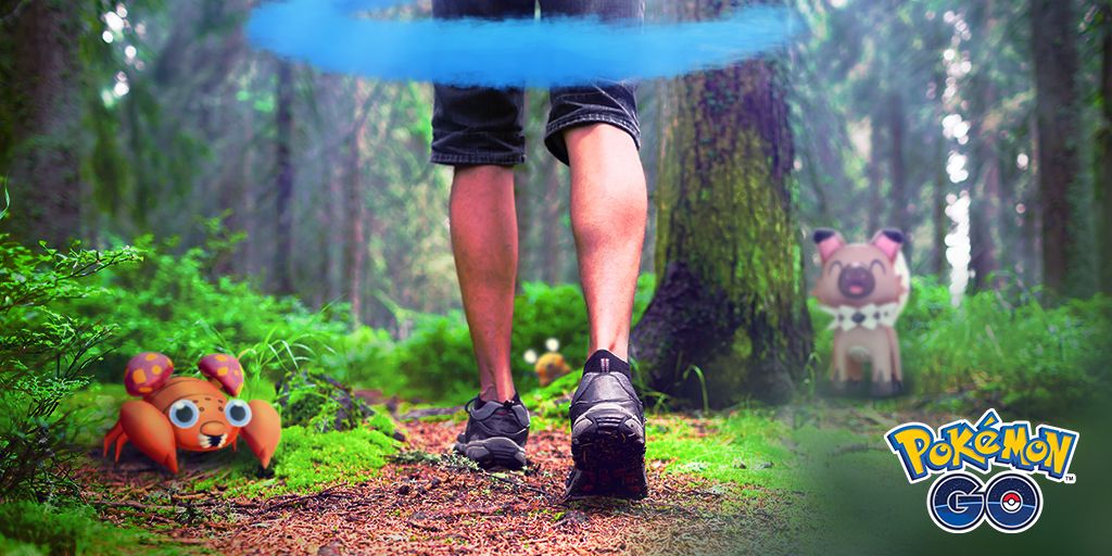 A Pokemon Go Trainer walking through a forest with the Daily Adventure Incense activated