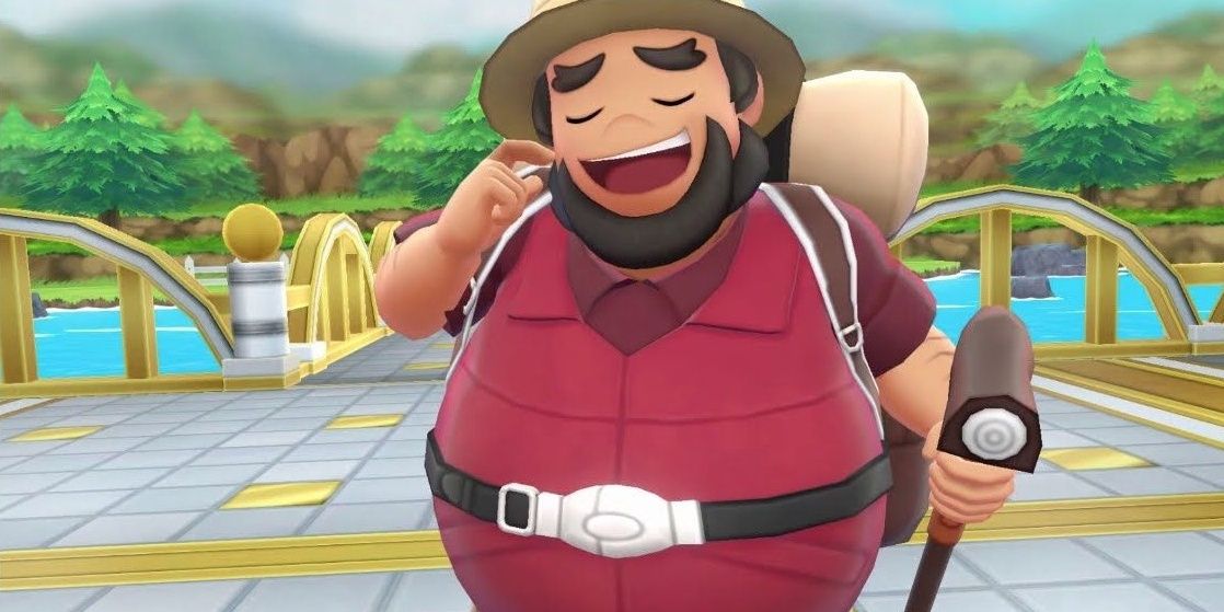 A hiker smiling and scratching his cheek