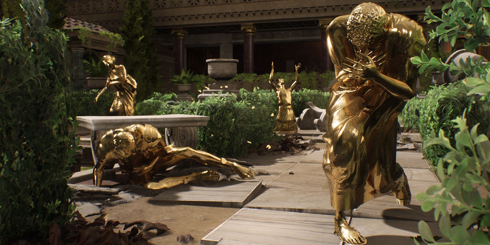 Four golden statues in a garden in The Forgotten City