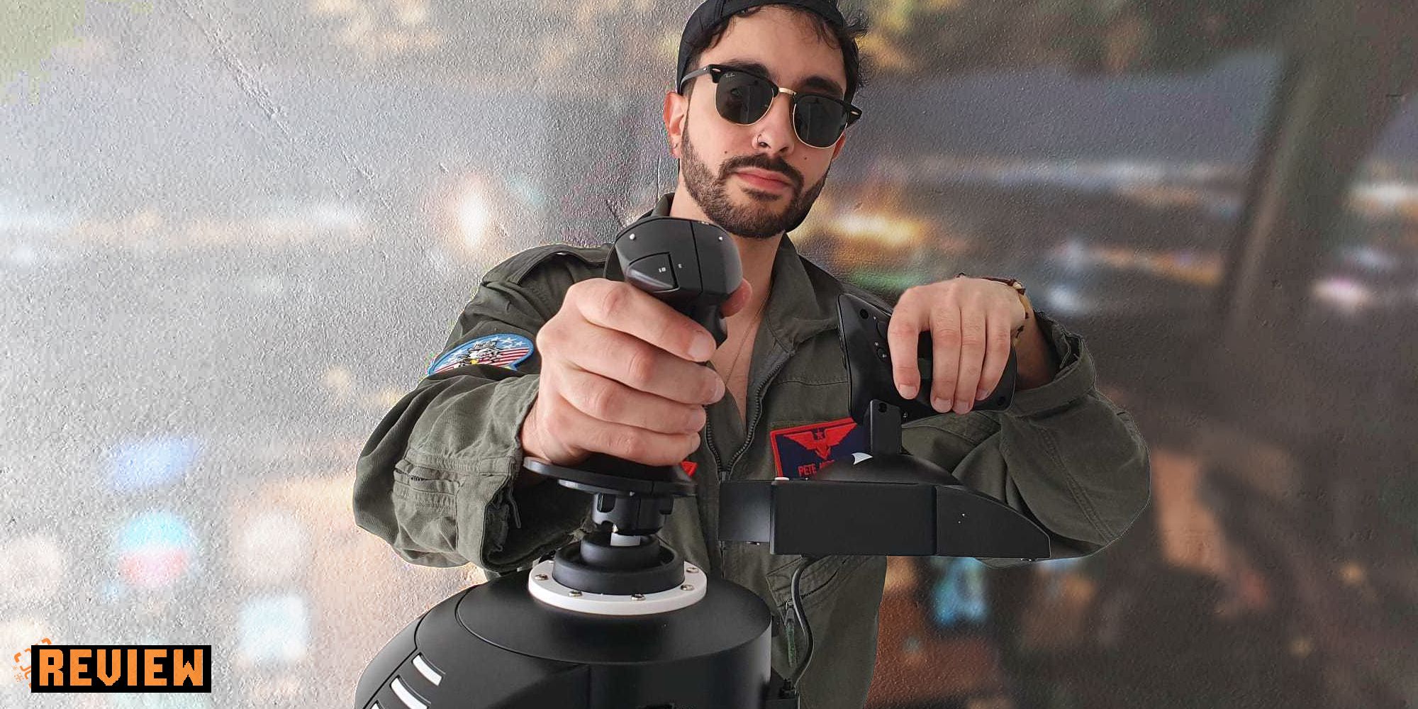 Thrustmaster Review - issy van der velde in a flight suit and sunglasses holding the thurstmaster 