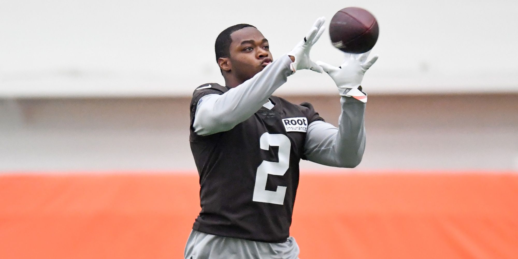 Amari Cooper catching a pass in practice in a brown Browns uniform