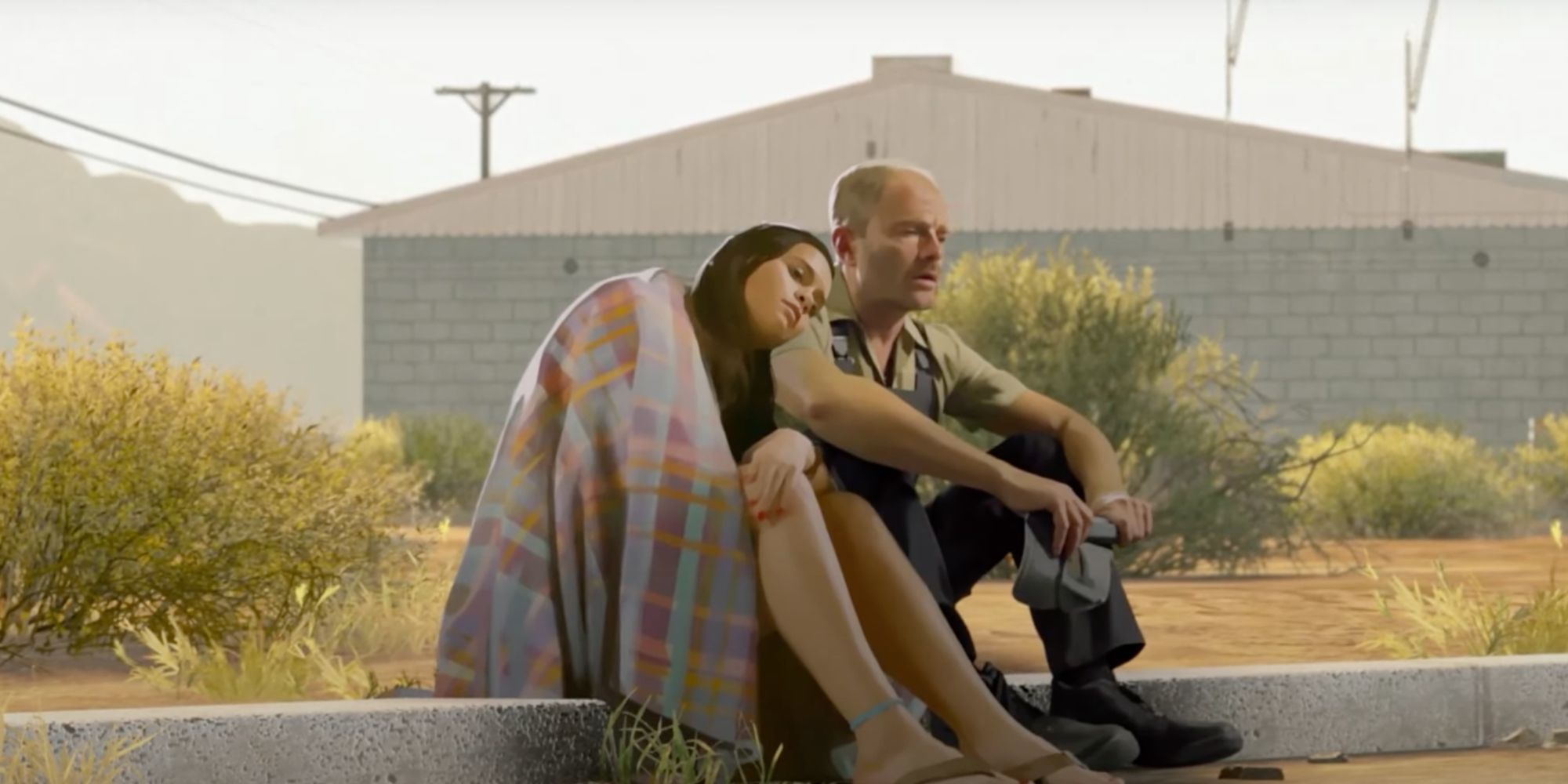 joyce and paul sitting on curb in front of motel in as dusk falls