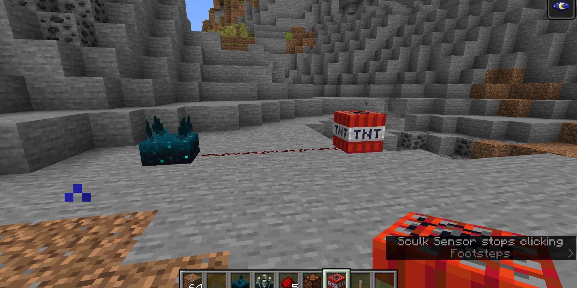 sculk sensor attached with redstone to tnt