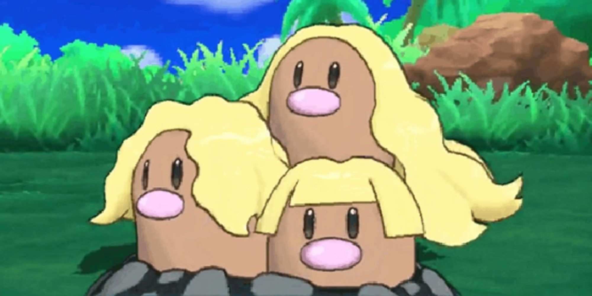Alolan Dugtrio pops out of the ground in a grassy field