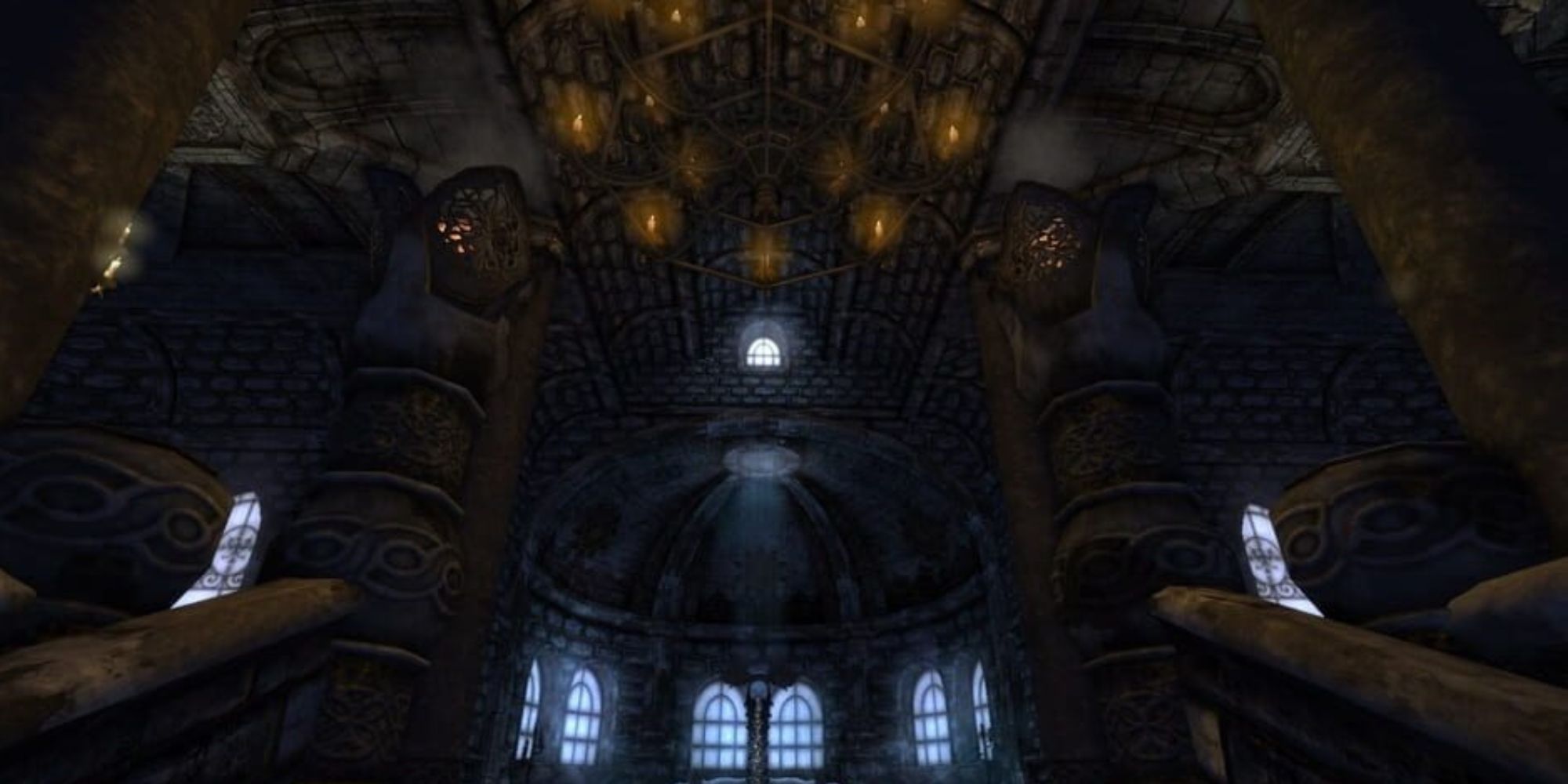 player goes up the staircase and sees the dark cathedral area with a huge chandelier hanging over with four pillars