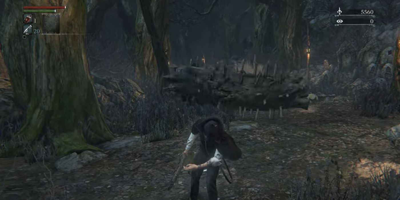 A log rolls at a Bloodborne player after dodging it the first time