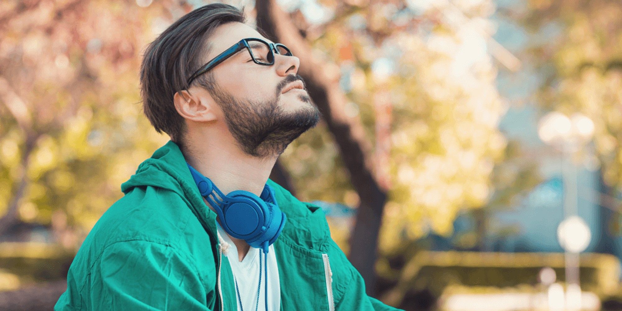 Breathing Man with headphones outside