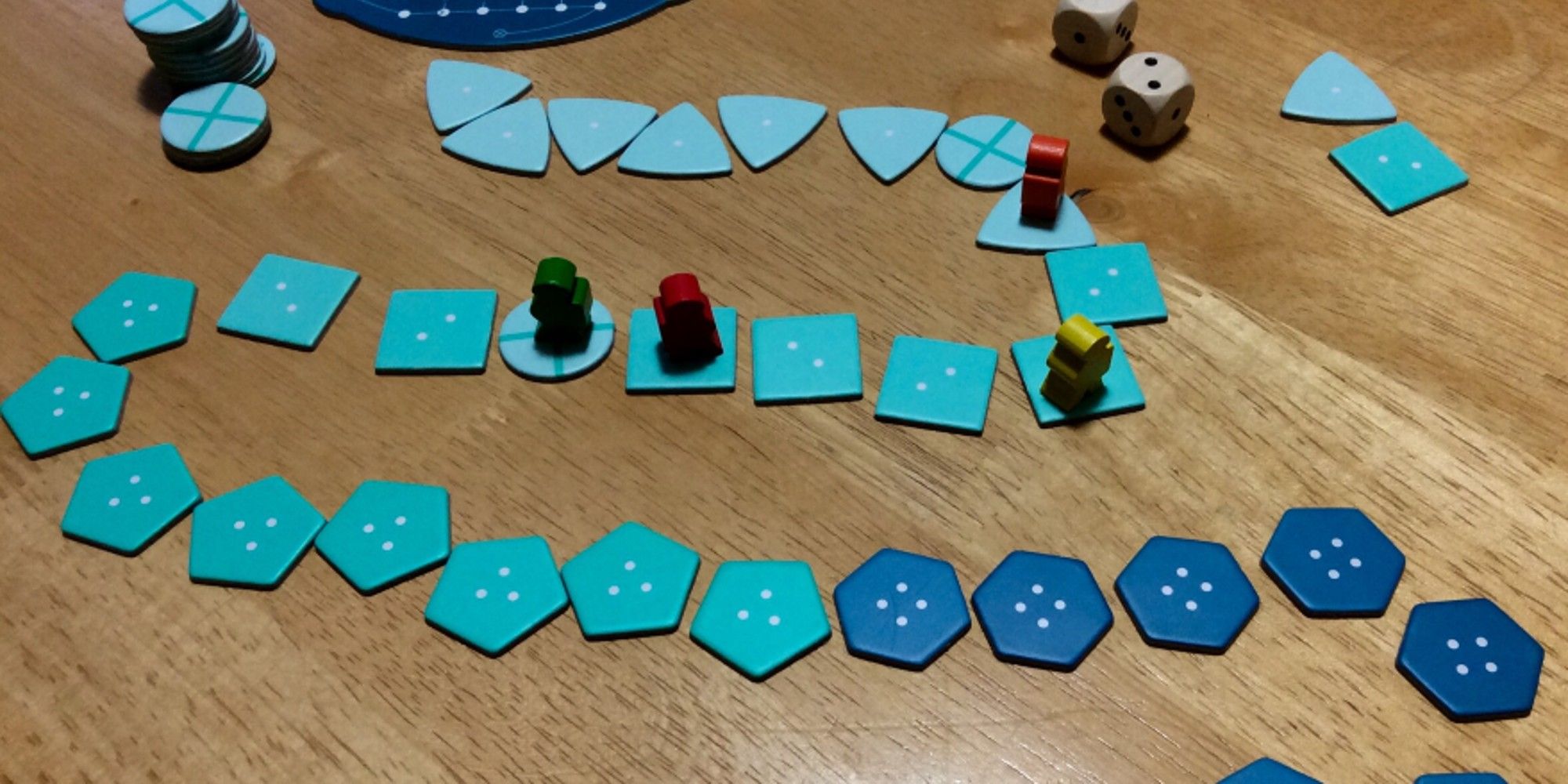 Deep Sea Adventure Board Game Pieces on wooden table