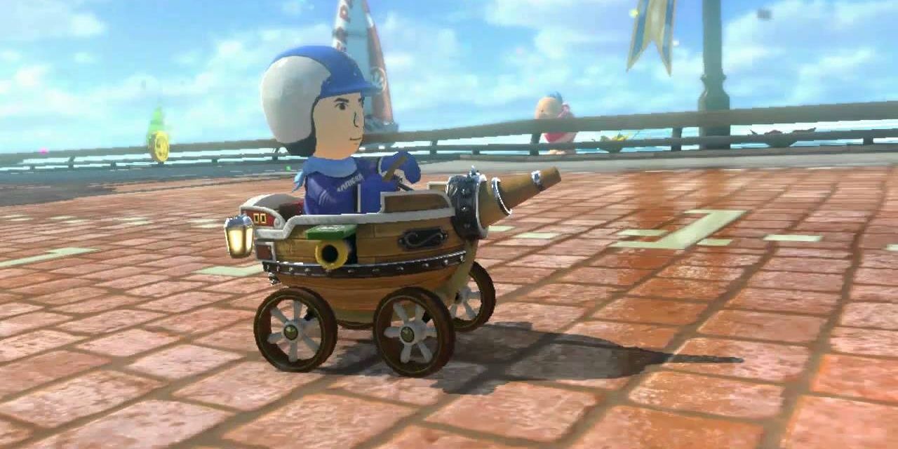 Landship in Mario Kart 8 Deluxe being driven by a Mii character on a brick road best vehicle Mario Kart 8