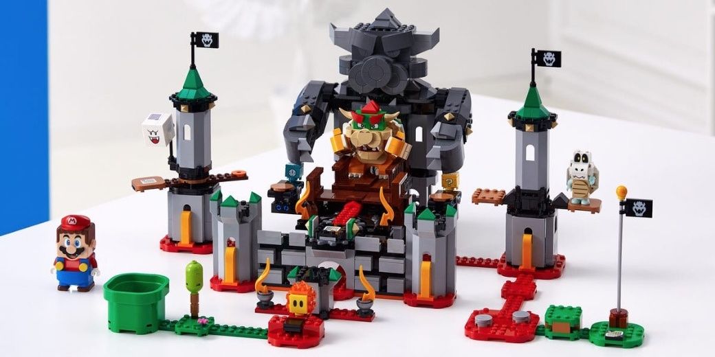 Lego Bowser's Castle on a white table with Mario, Bowser, and Dry Bones