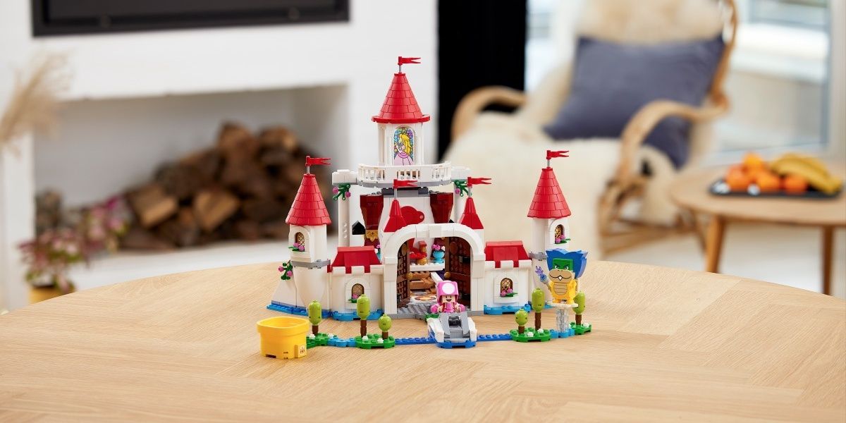 Lego Peach's Castle on a table in a living room