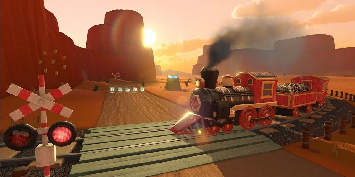 A train passing through a desert in front of a setting sun