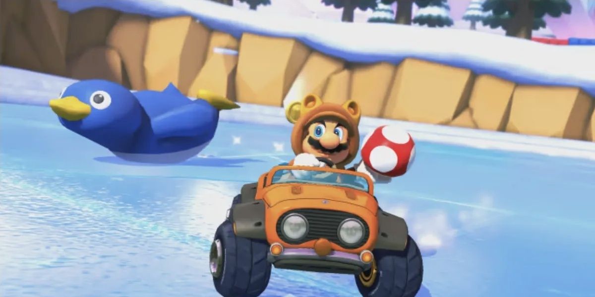 Tanooki Mario racing on ice in front of a penguin holding a mushroom