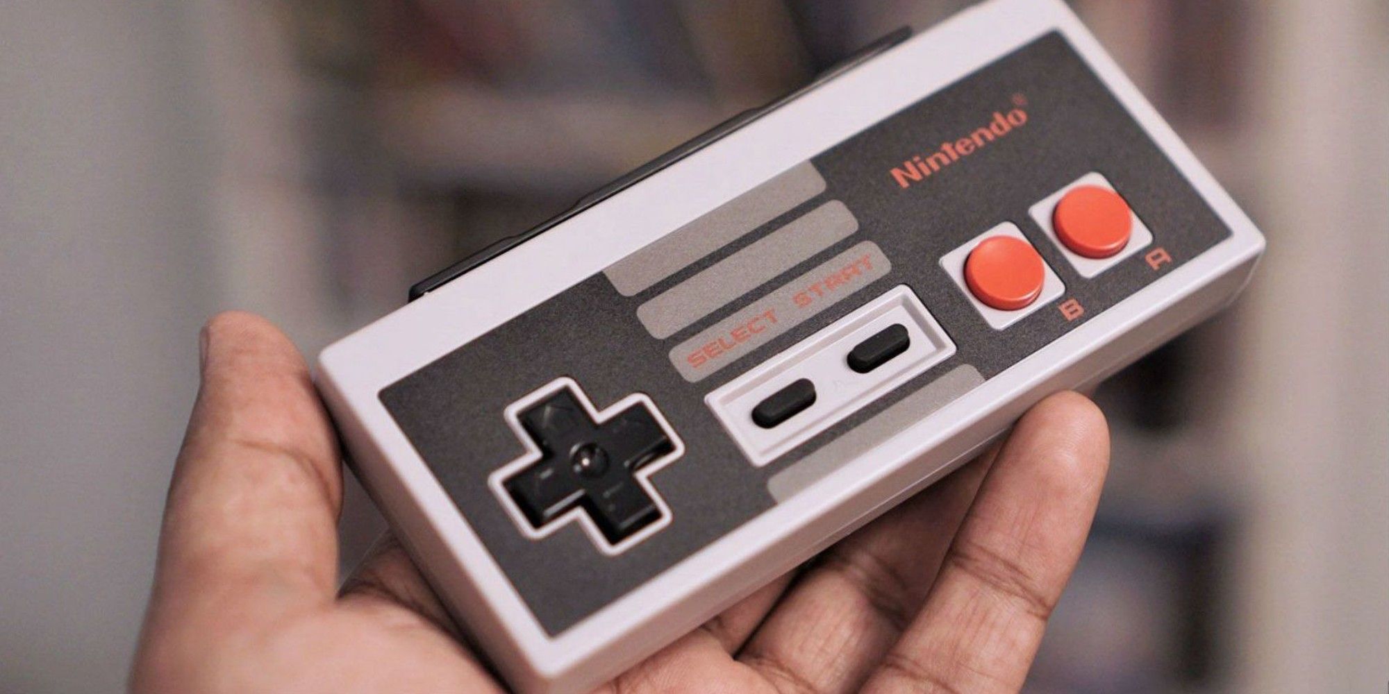 Nintendo Entertainment System Controller being held out