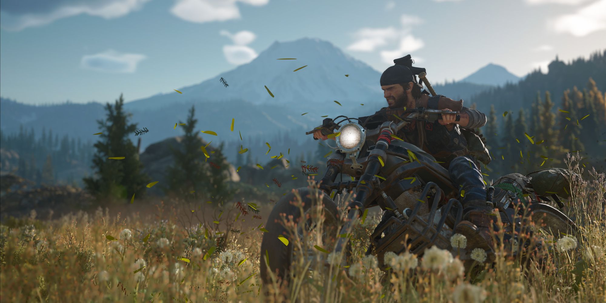 a wide shot of Deacon St. John on his bike from Days Gone driving through tall grass with mountains and trees in the distance