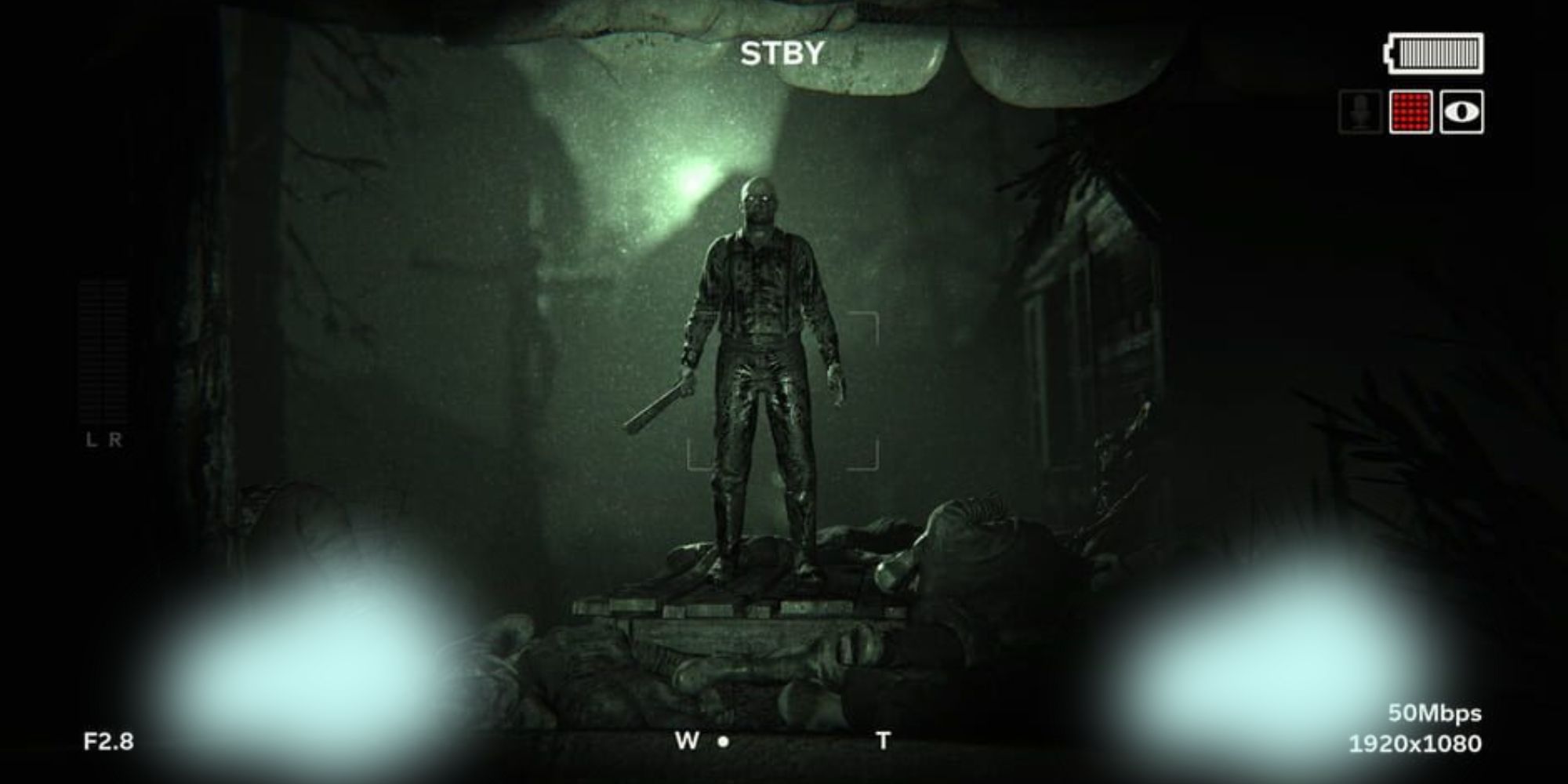 Cult Member with a machete stands in front of a crucified sacrifice in Outlast 2