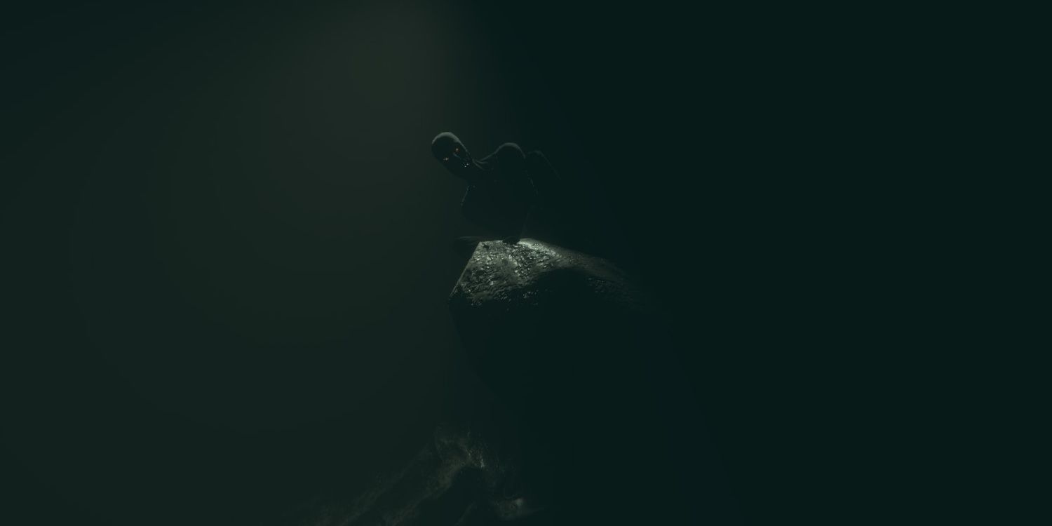 Shadow man perched on a rock