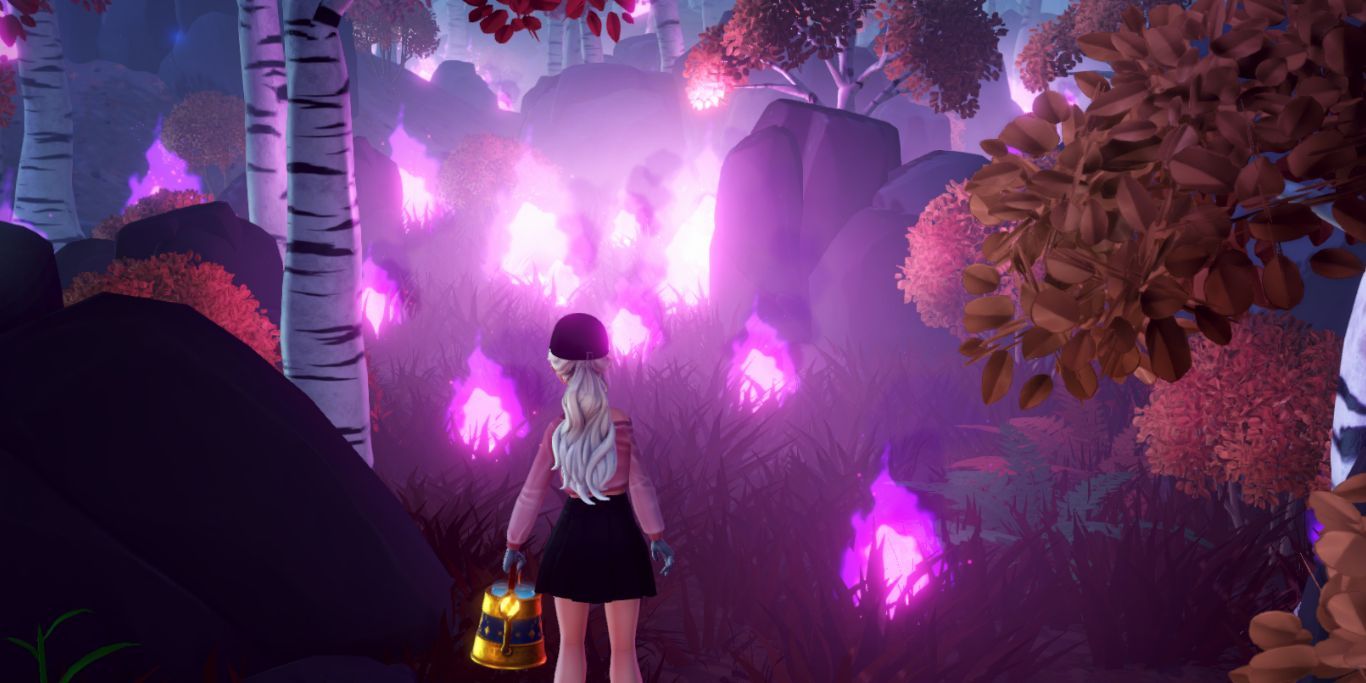  Main character looking at a forest on fire in Disney Dreamlight Valley.