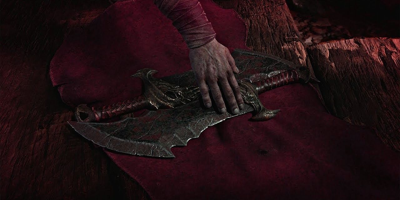 Kratos touching the Blades of Chaos after unwrapping them