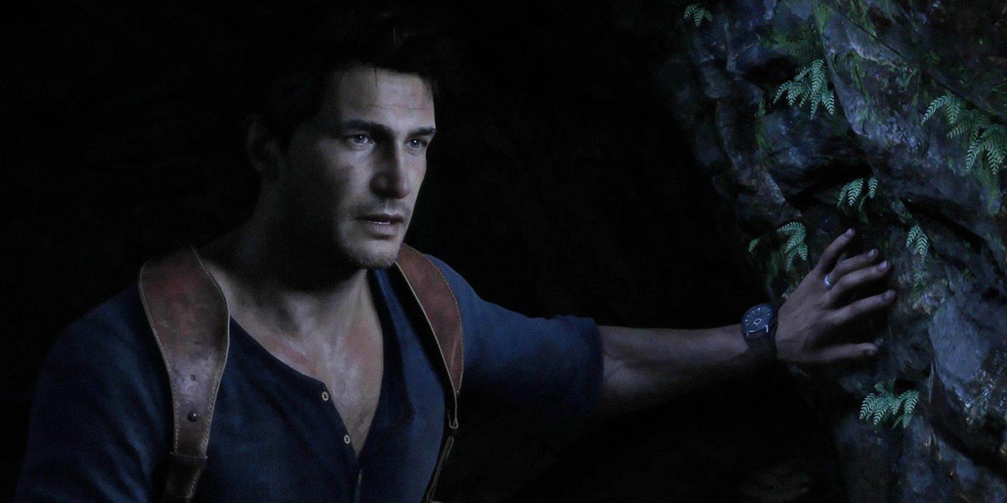 Nathan Drake from Uncharted 4, leaning on a rock and looking worried