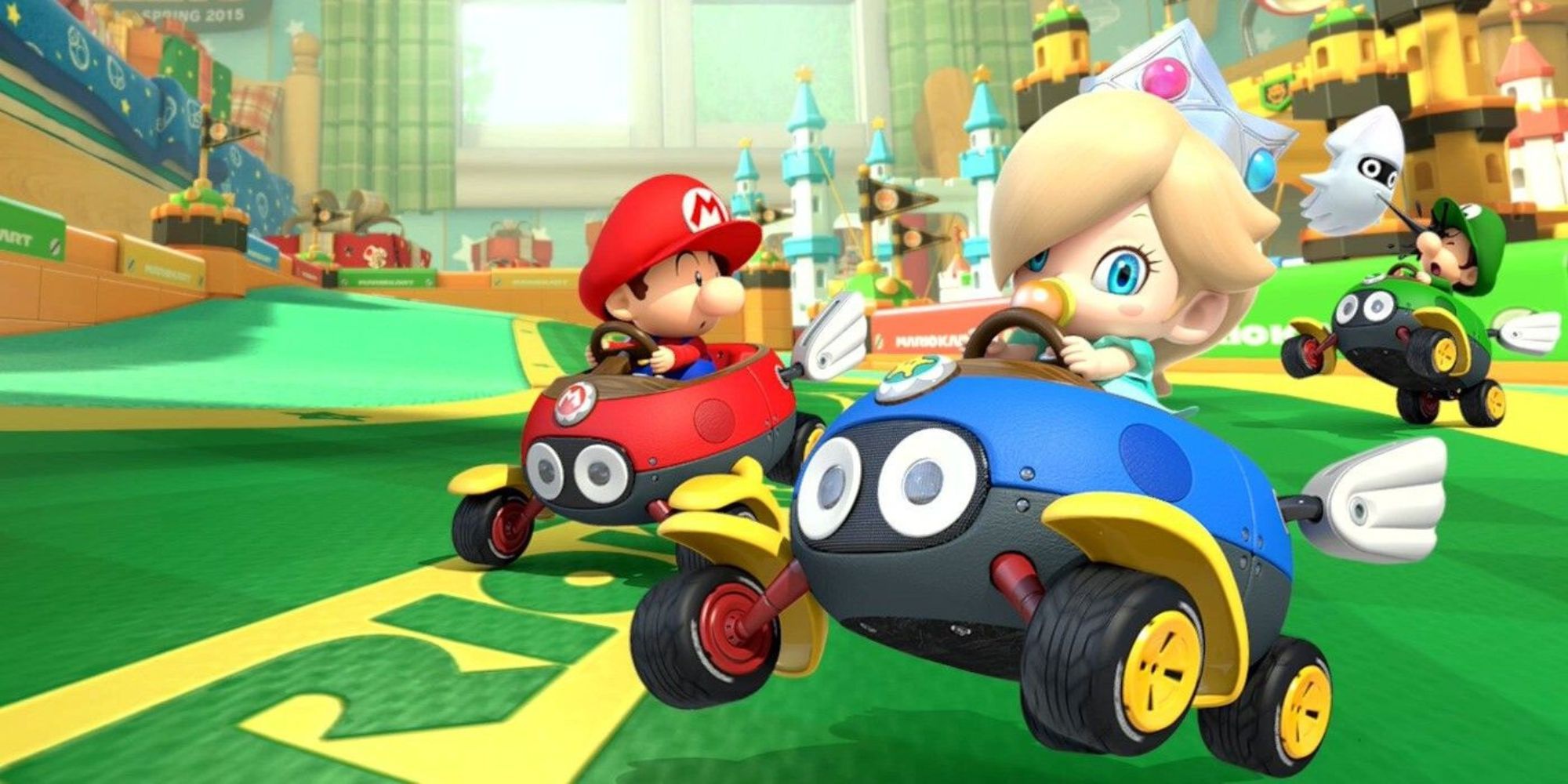 Baby Rosalina and Baby Mario drive down Ribbon Road while Baby Luigi gets inked by a Blooper