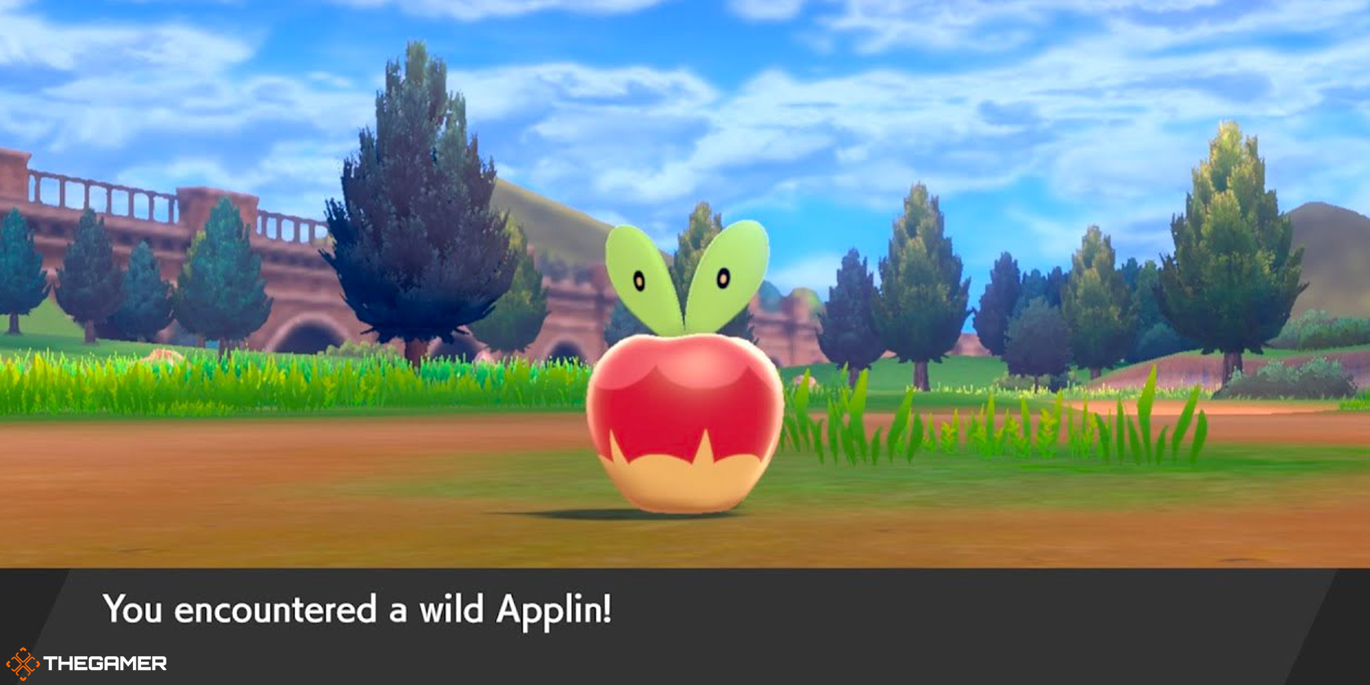 Applin sits on a dirty patch of grass in Pokemon Sword and Shield.