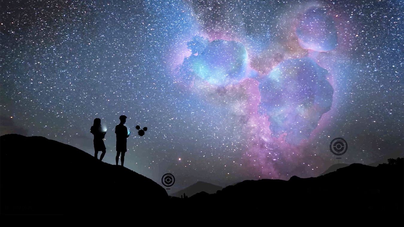 Pokemon Go image, showing two Trainers, two PokeStops, and Cosmog with a galaxy sky in the background