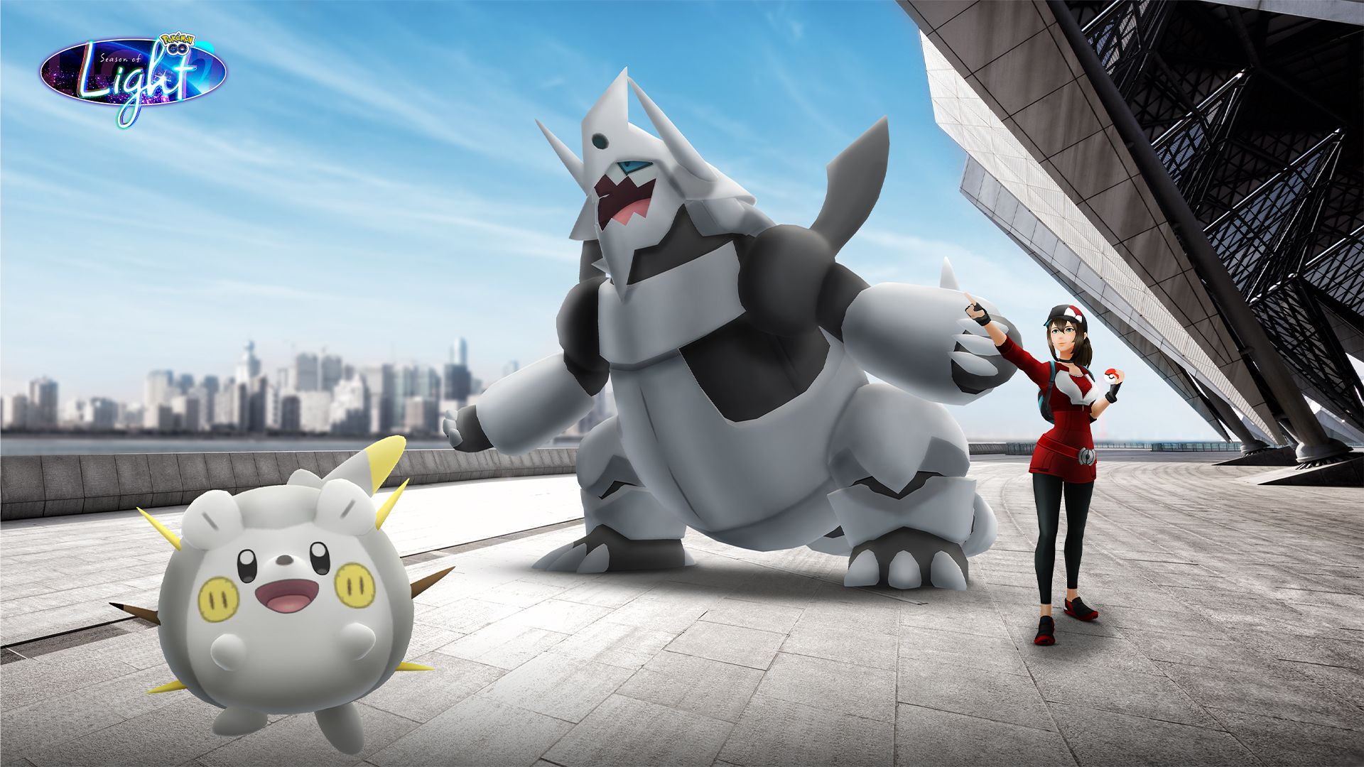 Togedemaru and Mega Aggron next to a Pokemon Go Trainer