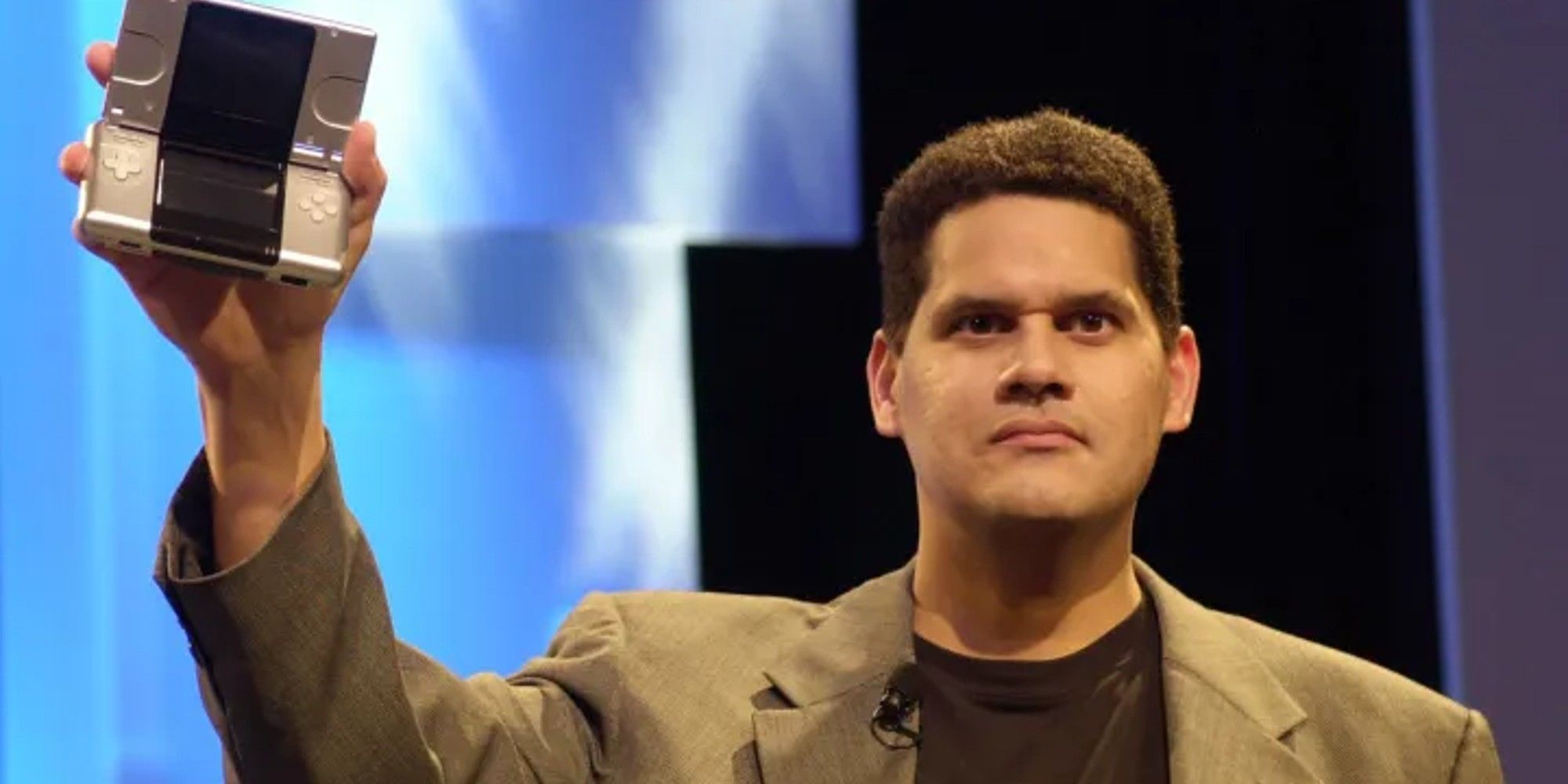 Reggie Fils-Aime with the original DS shown at E3 2004.