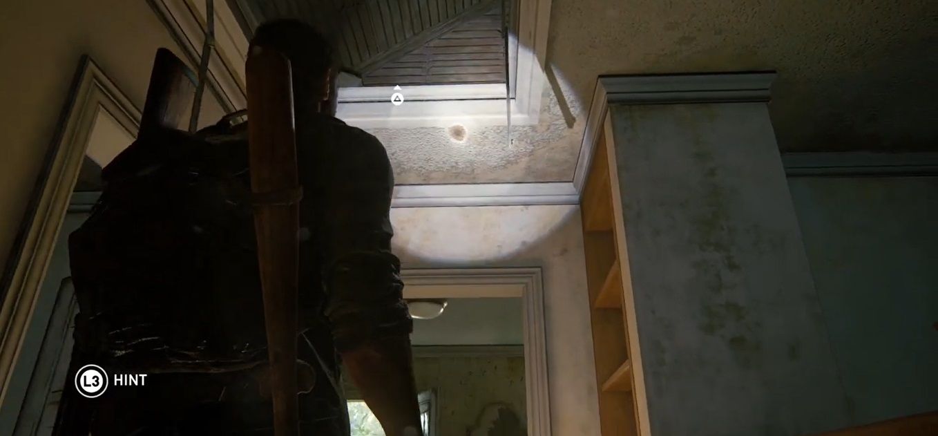Joel Miller points a touch and look at an Attic Hatch in The Last of US Part I
