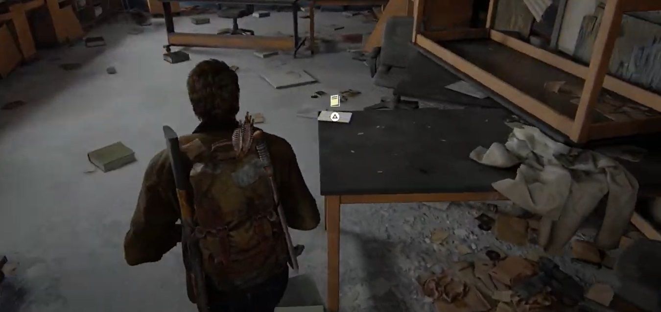 Joel Miller walks near a booklet on a table i the The Last of US Part I