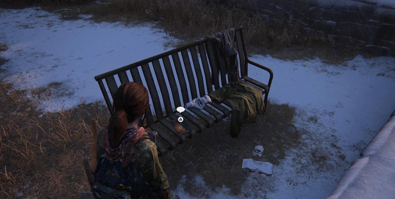 Ellie crouches and move under snow in The Last of Us Part 1