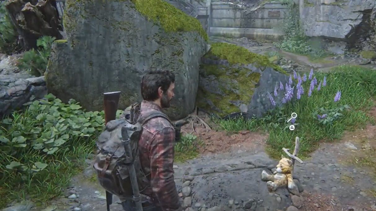 Joel approach a small grave with a teddy bear on it The Last of Us Part 1