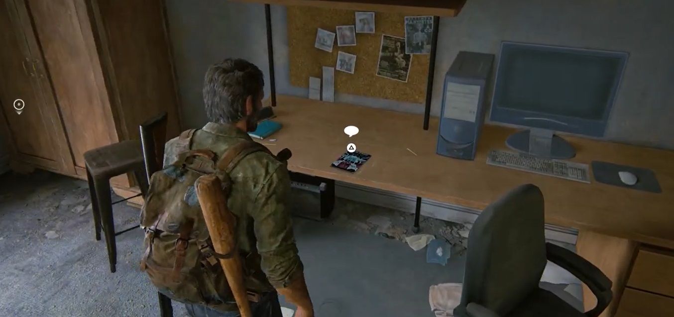 Joel look at a desktop and a comic in The Last of Us Part 1