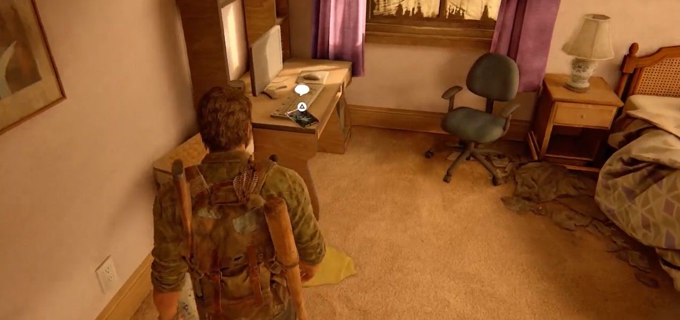 Joel stares at a desk in The Last of Us Part 1