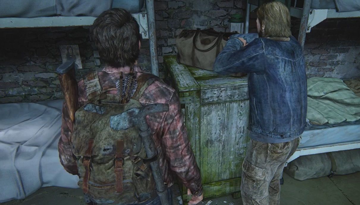 Tommy searches a bag inside his Dam while Joel stands beside him in The Last of Us Part 1