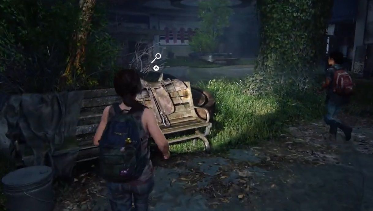 Ellie in front of a bench which has a horse saddle on it in The Last of Us Part 1 Left Behind