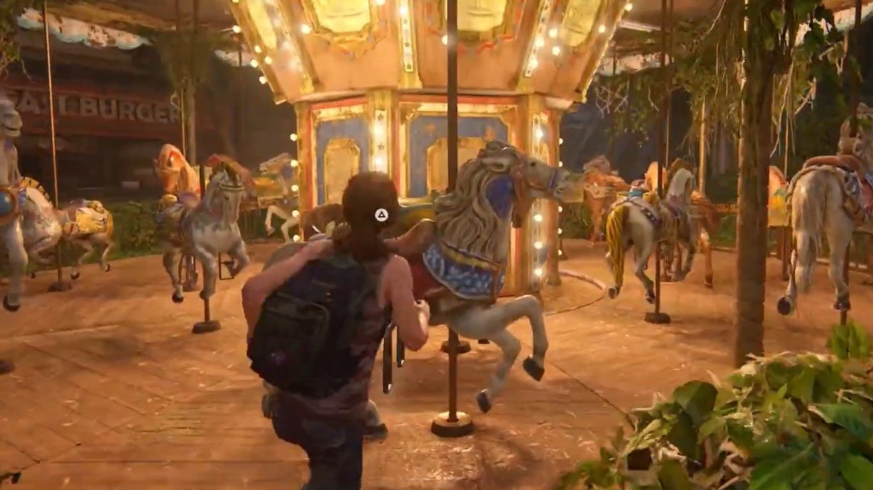Ellie walks near a Merry-Go-Horse in a carousel in The Last of Us Part 1 Left Behind